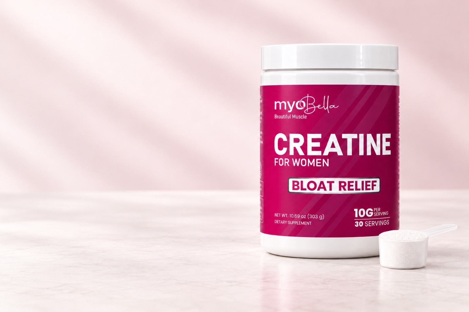 MyoBella Creatine for Women jar with a scoop of powder on a soft pink marble counter
